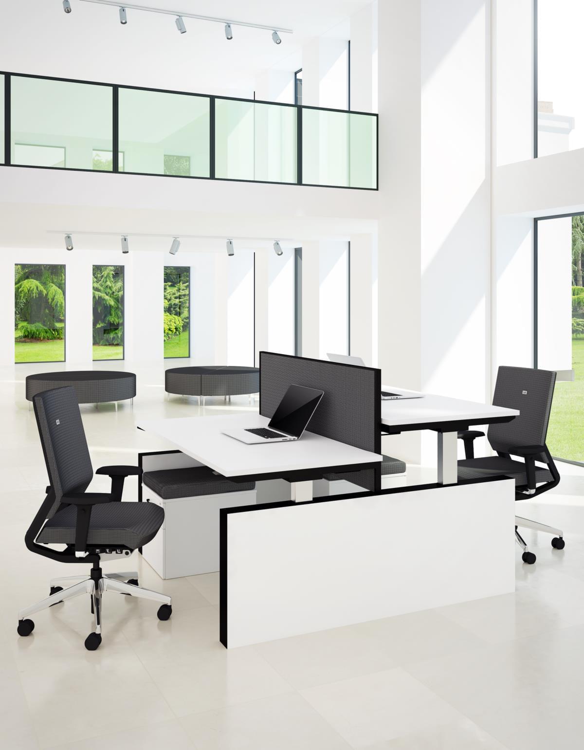 workspace with white Sit Stand Desks and black office chairs